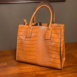 New with tags Frank Lyman hand bag.